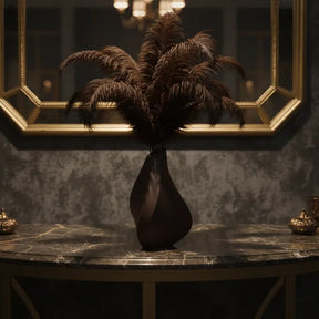 Sculptural black 3D printed vase with a contemplative form