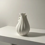 Sculptural white 3D printed vase with an organic spiral form