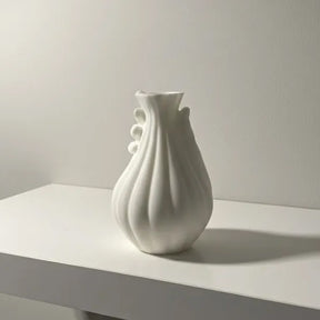 Sculptural white 3D printed vase with an organic spiral form