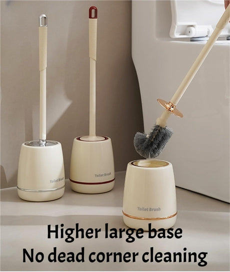 Gold toilet brush lifted from its matching storage holder