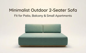 Two seater outdoor sofa in teal fabric on a solid teak frame