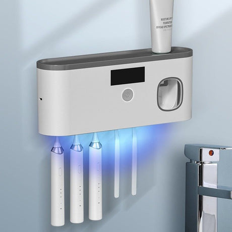 Grey wall mounted toothbrush holder with UV steriliser and automatic toothpaste dispenser