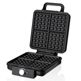 Waffle maker opened showing four grid non stick waffle plates