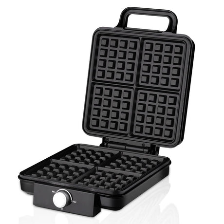 Waffle maker opened showing four grid non stick waffle plates