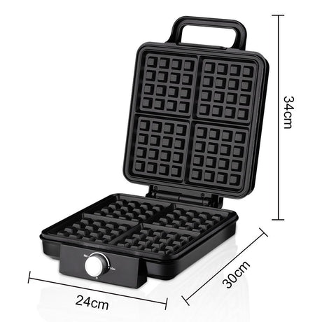 Four golden waffles cooked in the 1500 W waffle maker
