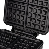 Side view of waffle maker showing hinged lid and compact body