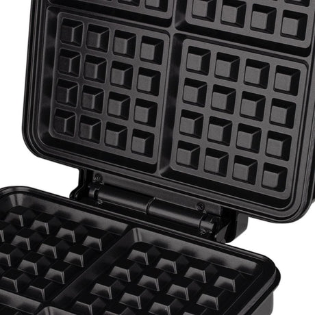 Side view of waffle maker showing hinged lid and compact body