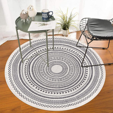 Grey round cotton rug showing Moroccan-style printed pattern