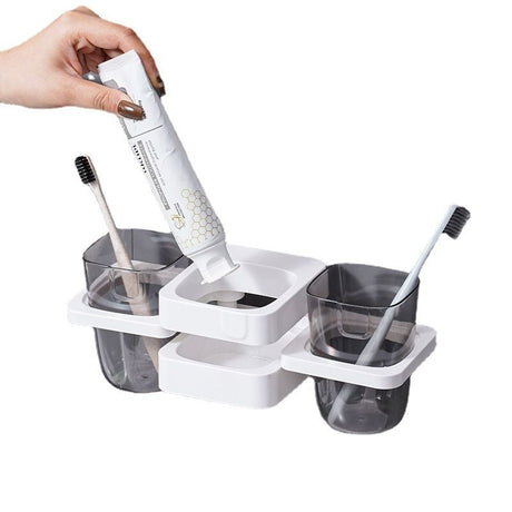 White freestanding toothbrush holder and countertop organiser with drainage base
