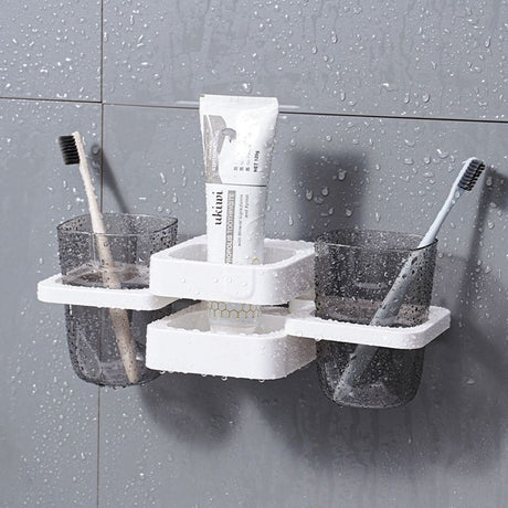 Electric toothbrush handles standing in the white countertop organiser