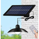 Solar chandelier with retro LED bulbs hanging over a garden patio