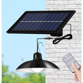 Solar chandelier with retro LED bulbs hanging over a garden patio