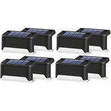 Black shell warm white solar step lights along outdoor decking steps