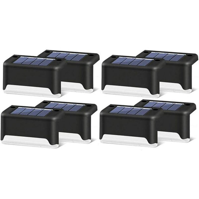 Black shell warm white solar step lights along outdoor decking steps