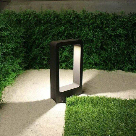 LED outdoor bollard light in black with warm white glow