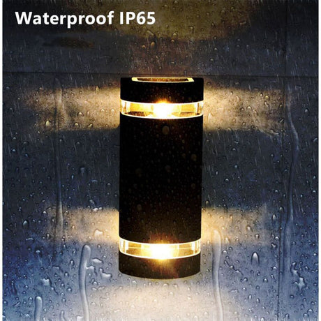 Black up and down outdoor wall light on an exterior wall