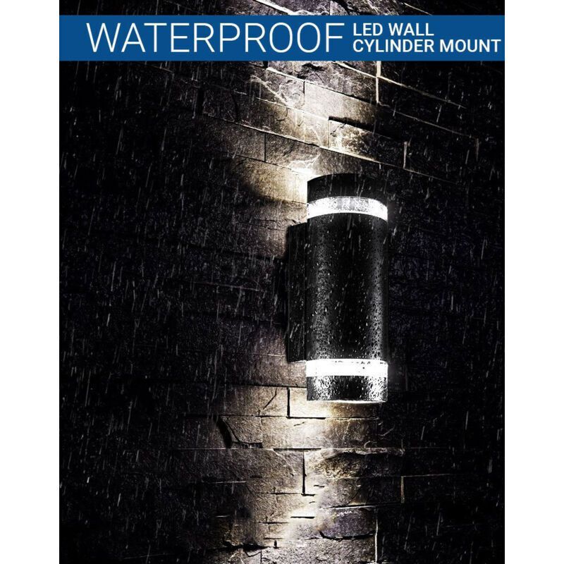 Black up and down outdoor wall light on an exterior wall