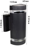 Black up and down outdoor wall light on an exterior wall