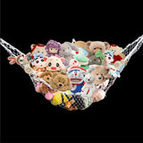 Jumbo white stuffed animal storage net in a room corner