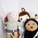 Stuffed animal net organiser holding plush toys