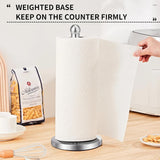 Paper towel holder standing on a kitchen benchtop beside a sink