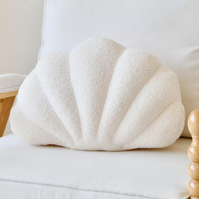 Wentworth Falls ivory plush seashell cushion on a bed