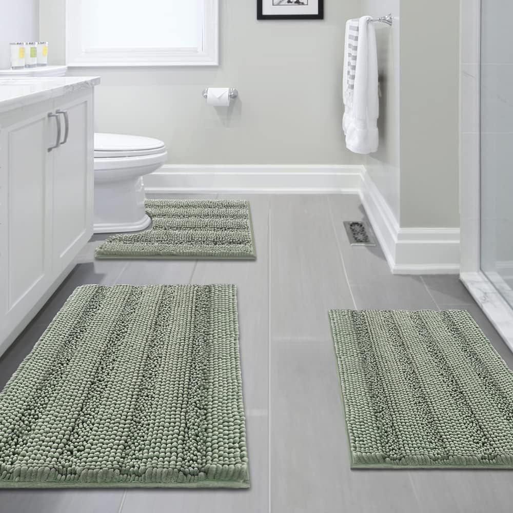 Sage striped chenille bathroom rug set of three pieces laid out on a floor