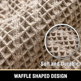 Tasselled end detail of the cream waffle bath mat