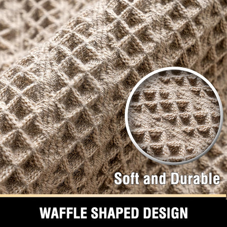 Tasselled end detail of the cream waffle bath mat