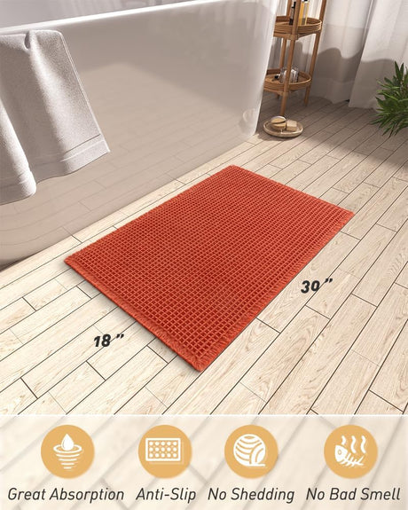 Close up of the deep waffle texture on the orange bath mat