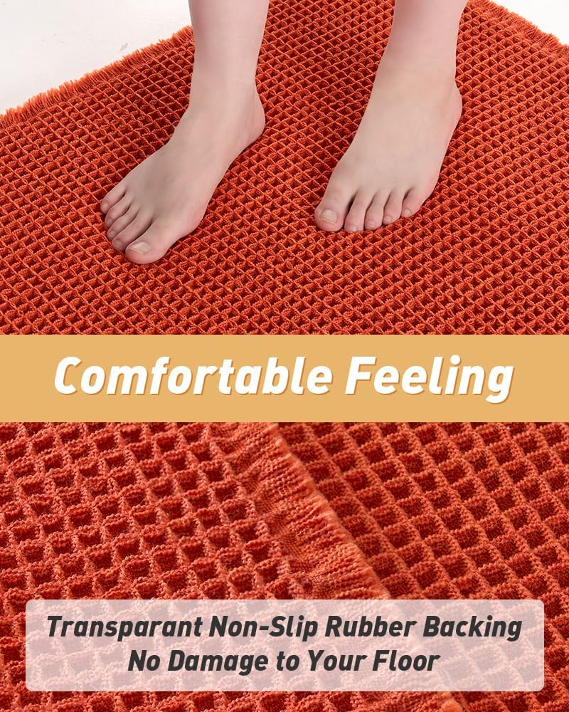 Underside of the orange waffle bath mat showing the clear rubber backing