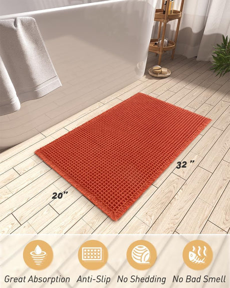 Close up of the deep waffle texture on the large orange bath mat