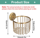 Brass roll holder mounted on a bathroom wall beside a toilet