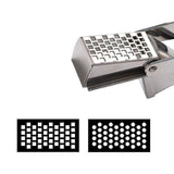 Garlic press crushing an unpeeled clove with one hand