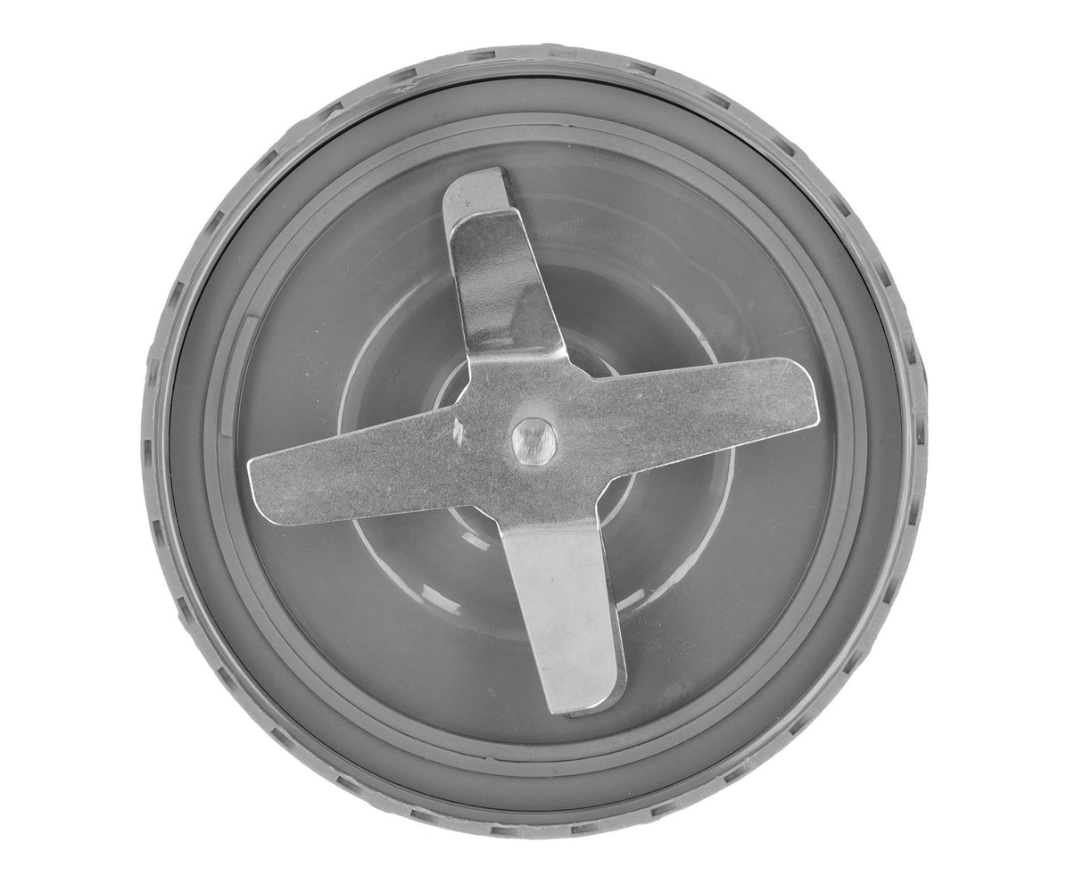 Blender blade being twisted onto a blending jug