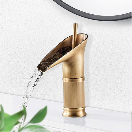 Antique brushed brass waterfall basin mixer tap with single lever handle
