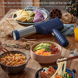 Green cordless electric pasta maker with noodle mould fitted