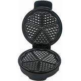 Waffle maker open showing the non stick plates that cook five waffles at once