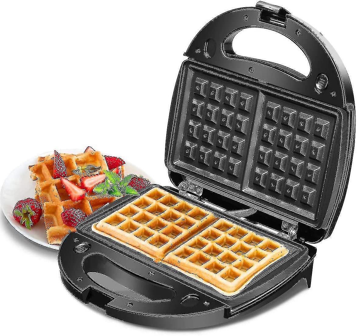 Black 2 in 1 waffle and sandwich maker closed on a kitchen bench