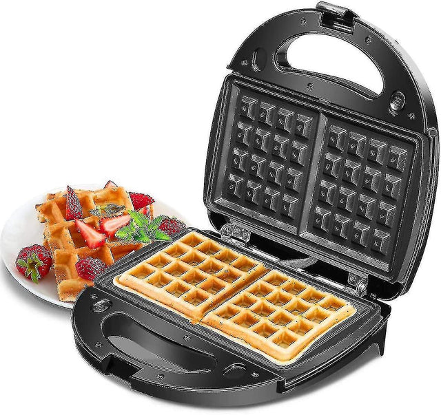 Black 2 in 1 waffle and sandwich maker closed on a kitchen bench