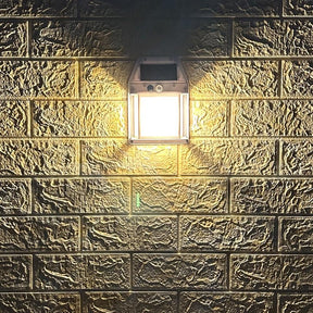 Warm white solar wall lights lighting a garden pathway and stairs