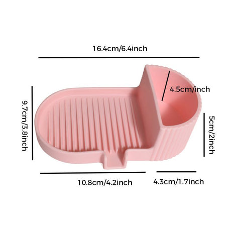 Pink silicone soap dish with grooved soap bed and side storage compartment