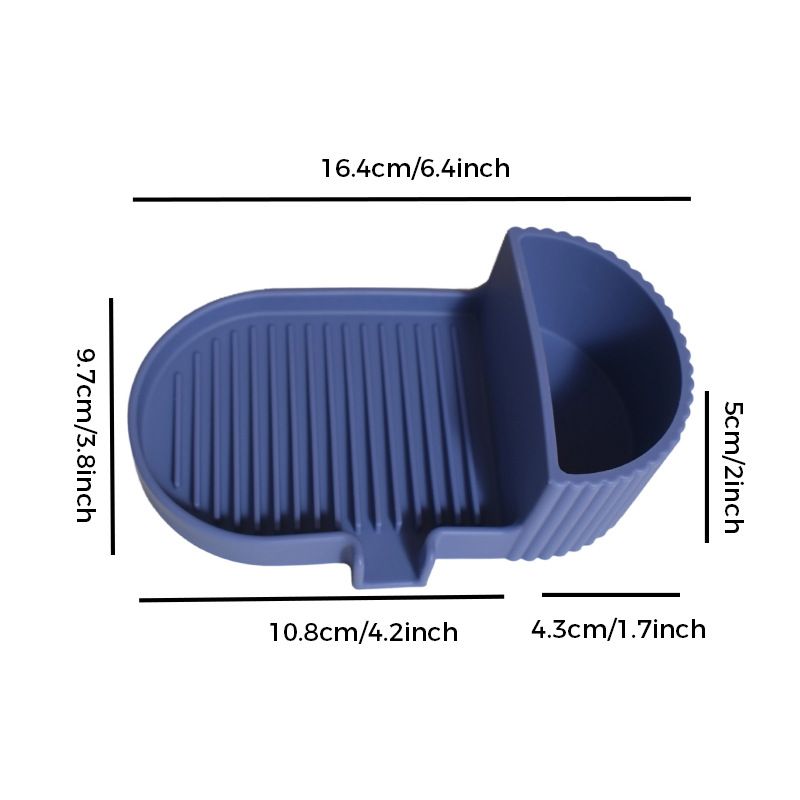 Dark blue silicone soap dish with grooved soap bed and side storage compartment