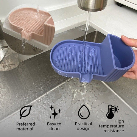 Soap bar resting on the tilted drainage grooves of the dark blue silicone dish