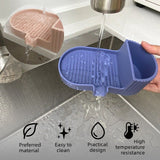 Soap bar resting on the tilted drainage grooves of the khaki silicone dish