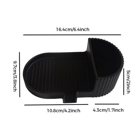Black silicone soap dish with grooved soap bed and side storage compartment