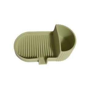 Olive green silicone soap dish with grooved soap bed and side storage compartment