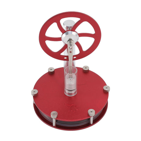 Side view of the aluminium Stirling engine measuring about 13 by 9 cm