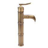 Copper bamboo joint basin mixer shown installed on a vessel basin