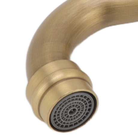 Antique brass basin tap styled in a hotel style washroom